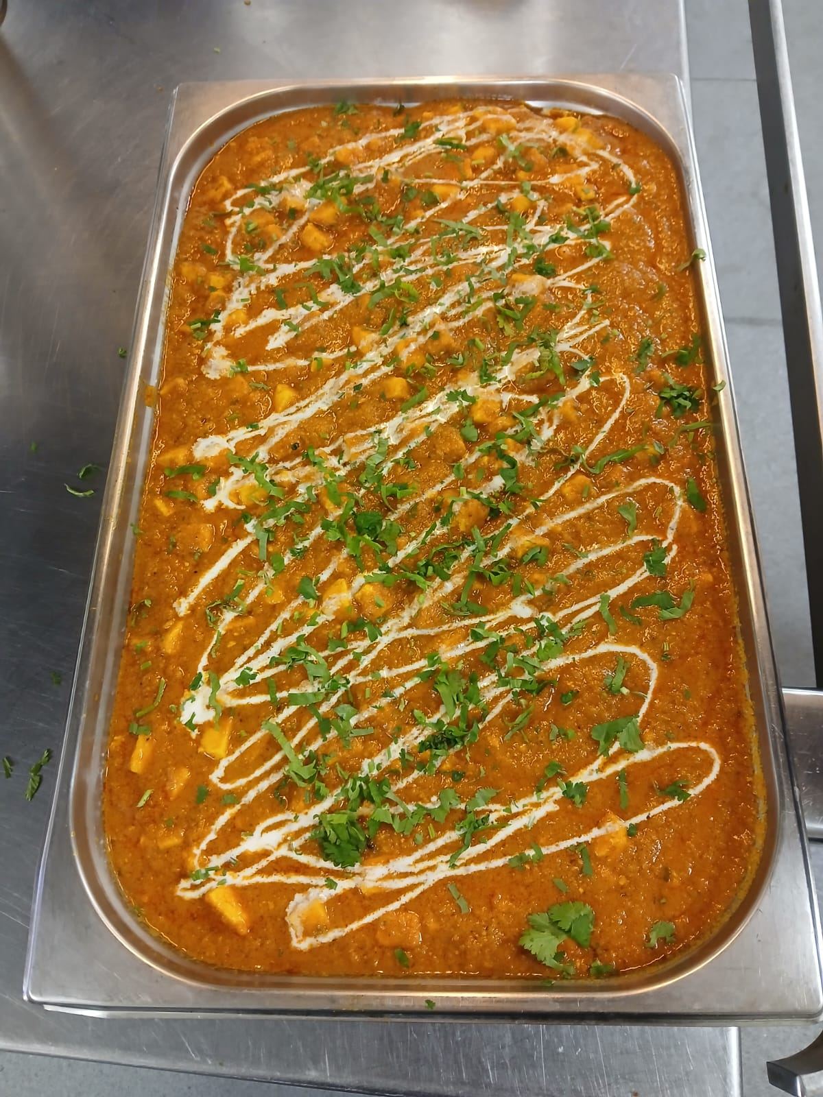 Freshly prepared paneer curry ready for service
